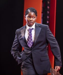 A black woman dressed up as man for the play Play On.